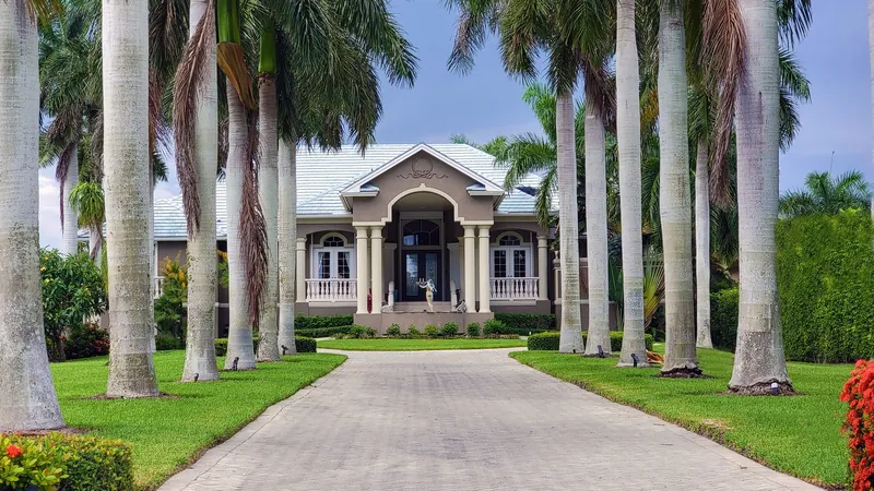 A Florida home exterior framed by palms