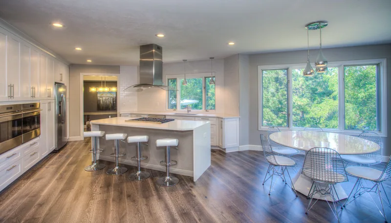 White architectural kitchen with a long island and clerestory windows