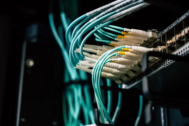 Neatly dressed network cabling in a dark equipment rack