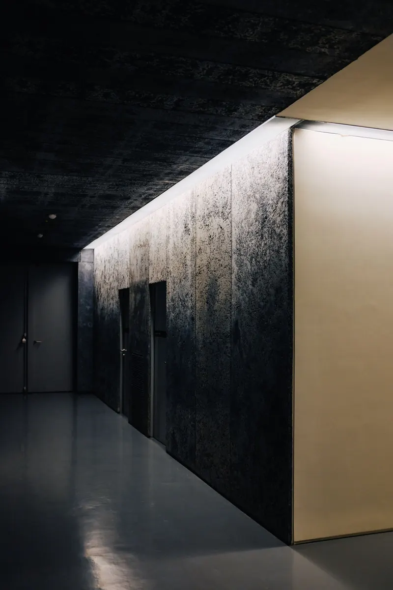The dark, quietly lit corridor outside the Vantage desk in Westlake
