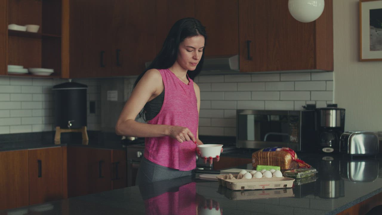 A dark, dramatically lit contemporary kitchen in Coral Gables, Miami
